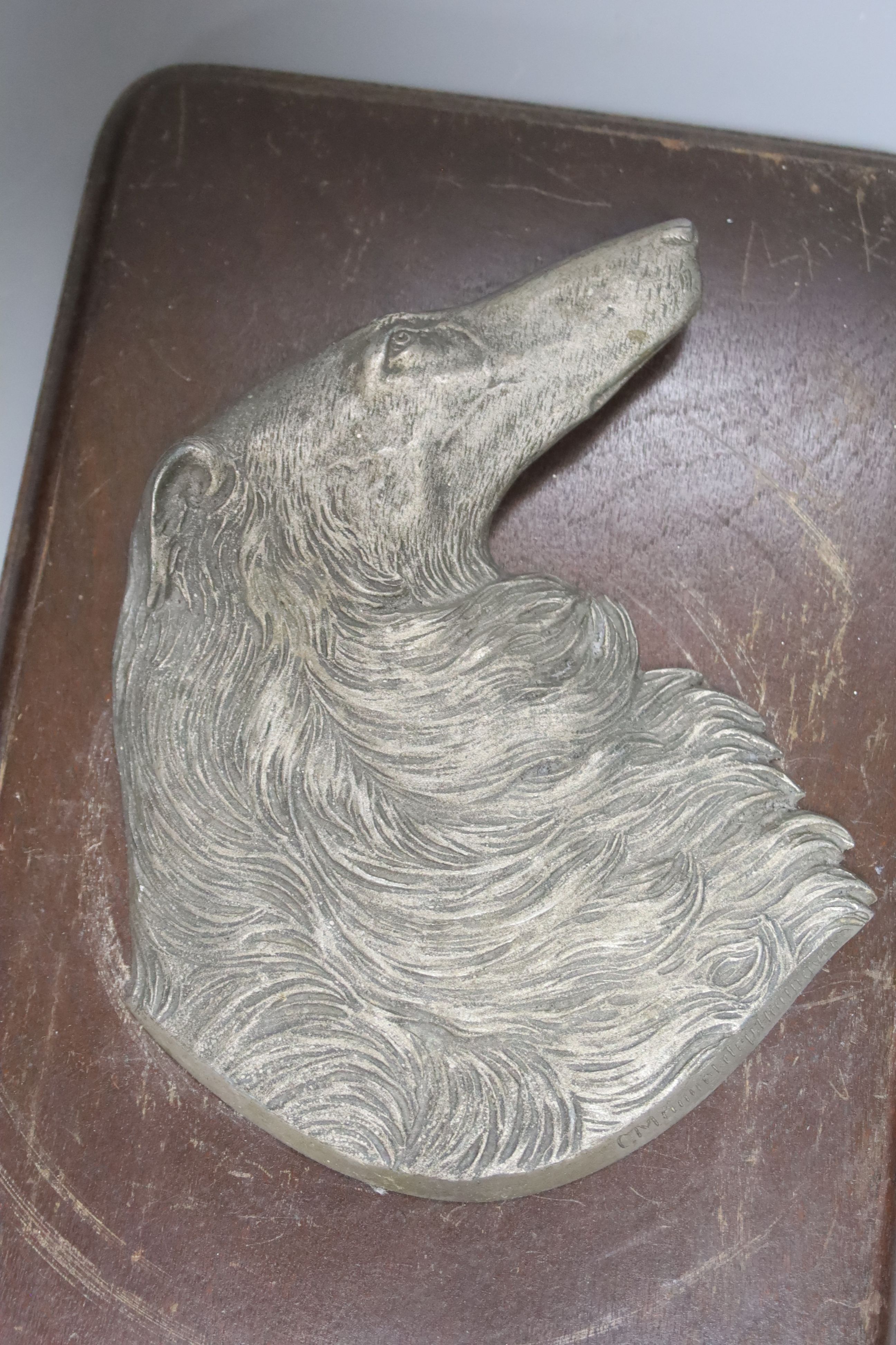 An early 20th century German mounted relief of a borzoi, 33 x 19cm